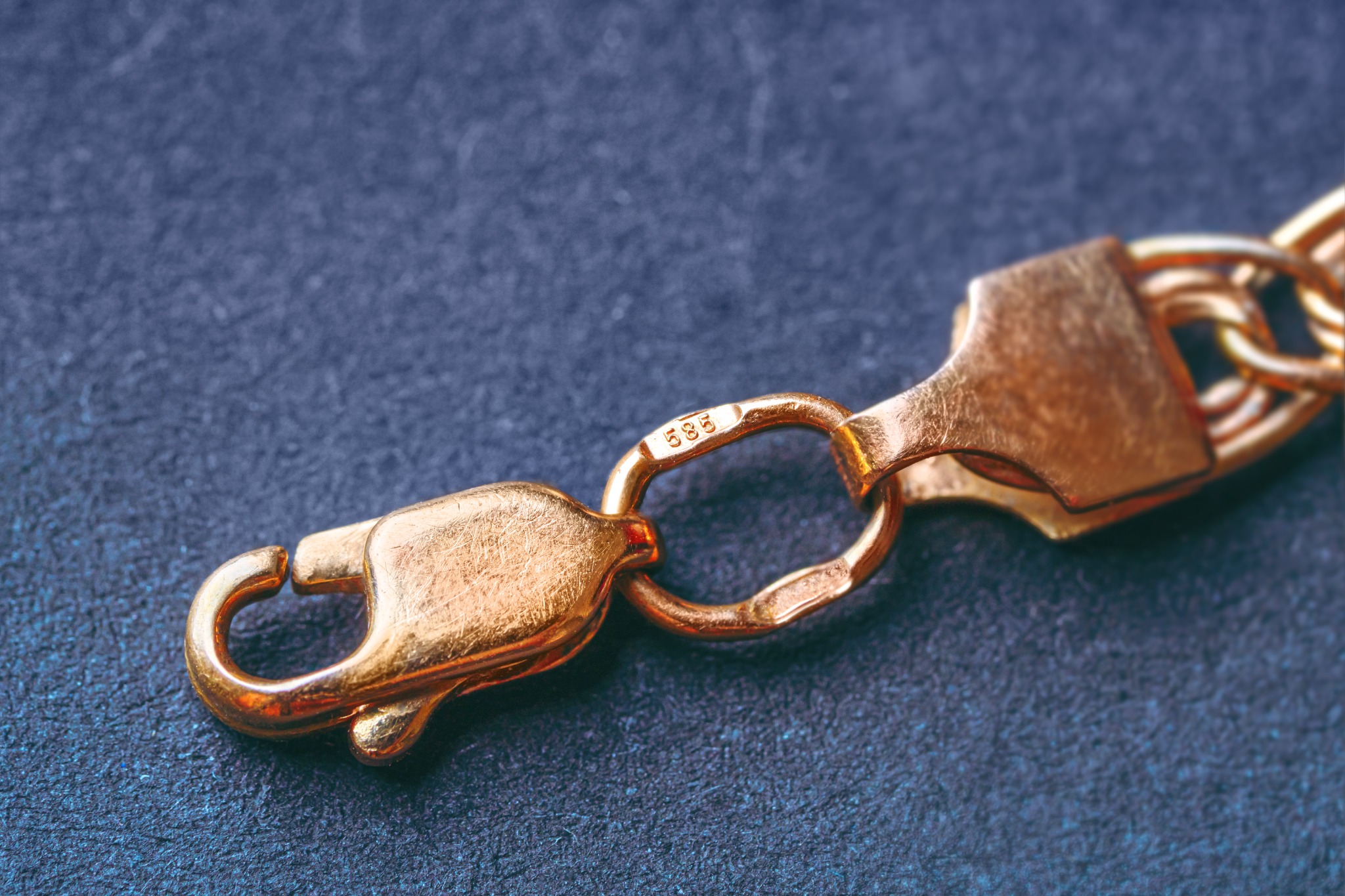 Close detail of a jewelry clasp and purity mark