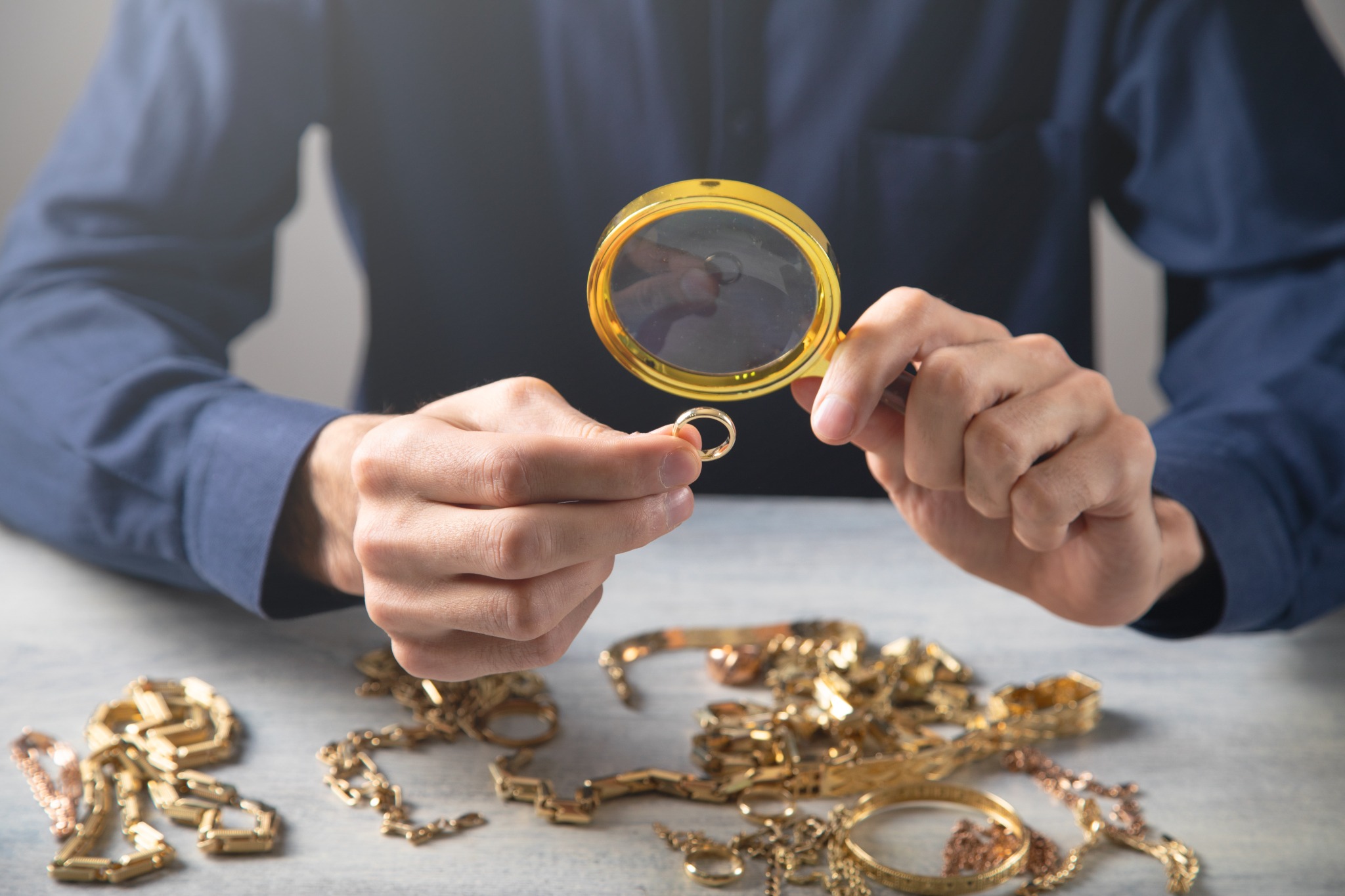 Jewelry inspected through a magnifying glass